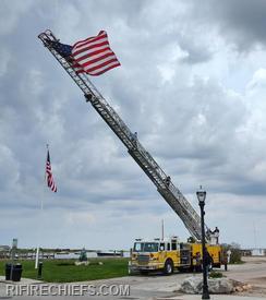 Watch Hill Ladder 104 displays the US Flag over Bay Street greeting members into the meeting. 